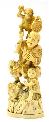 Lot 138 - A late 19th century Japanese marine ivory figure group of a man with boy and monkey (a.f.)