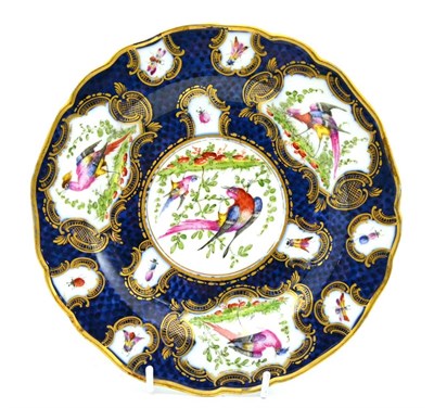 Lot 145 - A Samson of Paris plate decorated with birds and insects on a blue ground in the Worcester style