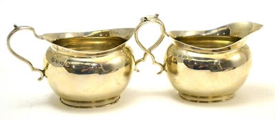 Lot 147 - A silver milk jug and sugar bowl
