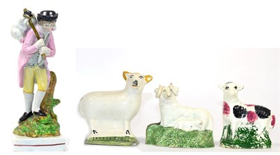 Lot 88 - A Staffordshire Pearlware Figure of a Lost Sheep, circa 1820, the standing shepherd holding a...