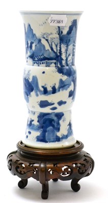 Lot 162 - A Chinese blue and white porcelain vase in a Kangxi taste, decorated with landscape, on a...