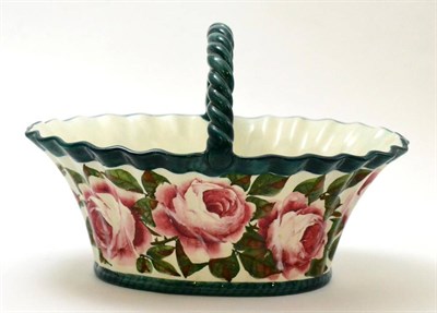 Lot 163 - A Wemyss pottery Cabbage Rose pattern basket with rope twist handle (with restoration)