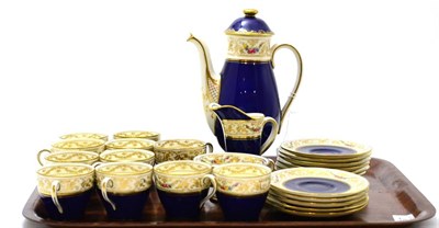 Lot 167 - A Royal Doulton coffee set decorated with floral swags on a cobalt blue ground, eleven cups and...