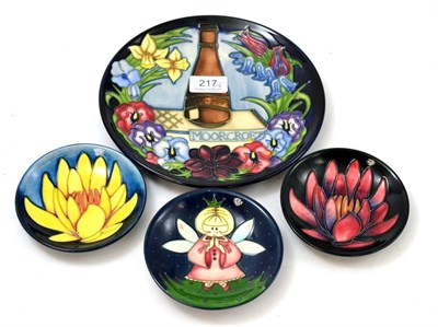 Lot 217 - A Moorcroft 1897-1997 plate, numbered 179/750, 22cm diameter; two Moorcroft May Lily pattern...