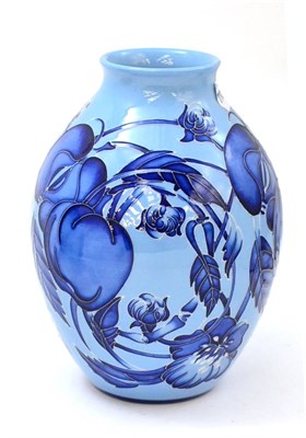 Lot 220 - A modern Moorcroft Dundela Orchard blue on blue pattern vase, designed by Emma Bossons, 21cm