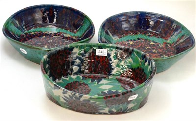 Lot 242 - Three large Sophie Hamilton pottery dishes, unmarked, 34cm, 37cm and 39cm wide