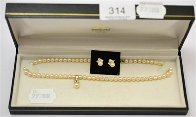 Lot 314 - A pearl and diamond necklace with a 9ct gold mount and clasp together with a pair of similar...