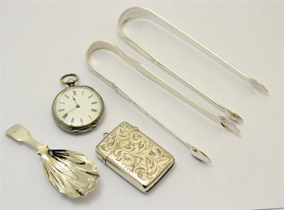 Lot 320 - Two pairs of bright cut silver sugar tongs, one with Newcastle hallmarks by T W, a silver caddy...
