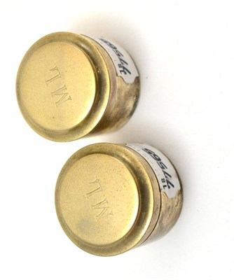 Lot 326 - A pair of Continental white metal small cylindrical boxes, the covers engraved ML