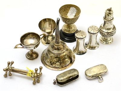 Lot 328 - A group of silver including two sovereign holders, a pair of knife rests, wine funnel, a trophy, an