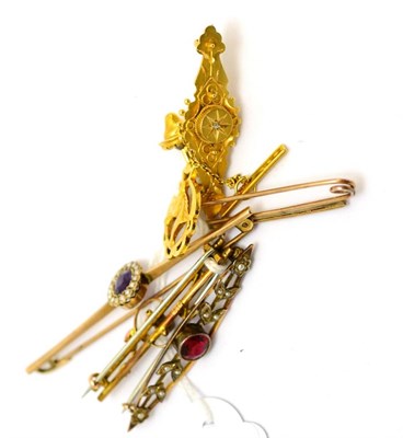 Lot 332 - A 9ct gold horse's head pin, a ruby and diamond pin and four stone set bar brooches
