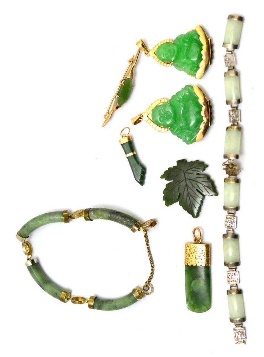 Lot 342 - A group of Oriental green hardstone jewellery mounted in yellow metal, unmarked, including...