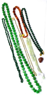 Lot 343 - A group of bead necklaces, including green hardstone, amber coloured etc