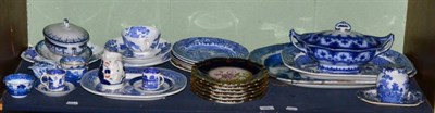 Lot 352 - A shelf of blue and white pottery including tea bowls and saucers, meat dishes, tureens, and a...