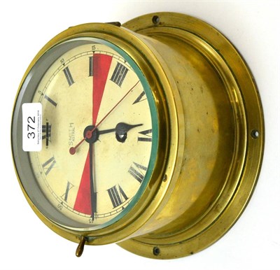Lot 372 - A brass cased Smiths Astral bulkhead ships clock painted with radio silence zones