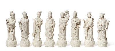 Lot 120 - A Set of Eight Blanc de Chine Figures of Immortals, late 19th/early 20th century, each standing...