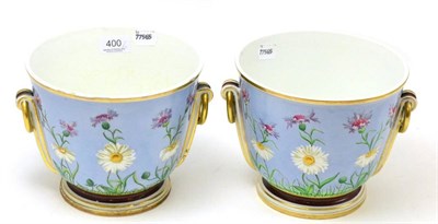 Lot 400 - A pair of 19th century Minton floral painted twin ring handled jardinieres, with impressed marks to