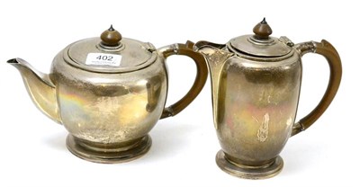 Lot 402 - An Edward VIII silver teapot and hot water jug, Sheffield 1936