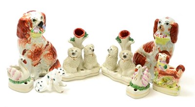 Lot 411 - Eight Staffordshire figures of spaniels and swans