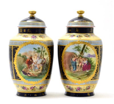 Lot 469 - A pair of Vienna porcelain covered jars