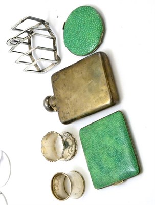 Lot 475 - A silver hip flask, toast rack, two napkin rings, a shagreen compact and cigarette case