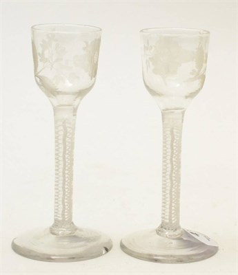 Lot 476 - A pair of 18th century double series opaque twist cordial glasses, the bowls etched with...