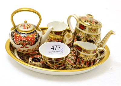 Lot 477 - A miniature Royal Crown Derby tea service on an oval Royal Crown Derby tray