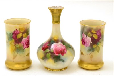 Lot 478 - A pair of Royal Worcester floral decorated cylindrical vases and another Royal Worcester floral...