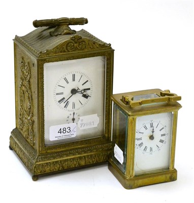 Lot 483 - A 19th century French alarum desk clock in anthemion cast brass case and a brass carriage timepiece