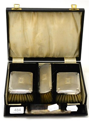 Lot 484 - A gentleman's silver backed brush set, Birmingham 1934