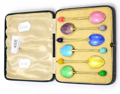 Lot 488 - A set of six silver gilt and enamel spoons (cased)