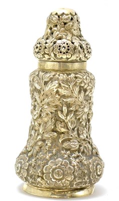 Lot 523 - A silver sugar caster with floral decoration in heavy repousse