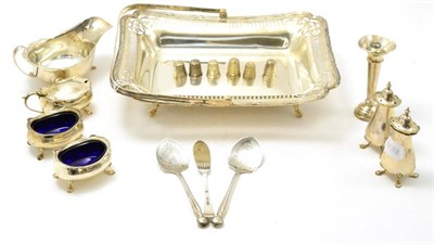 Lot 533 - A group of silver including a swing handled basket, sauce boat, bud vase, pair of pepperettes,...