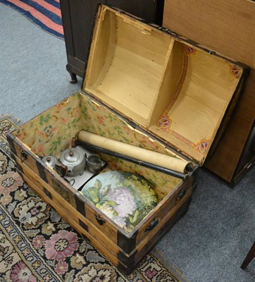 Lot 1021 - A domed top chest containing a floral painted plate