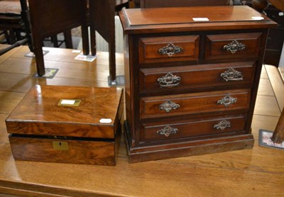 Lot 1030 - An early 20th century mahogany miniature chest of drawers, together with a 19th century writing...