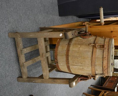 Lot 1037 - A butter churn on stand