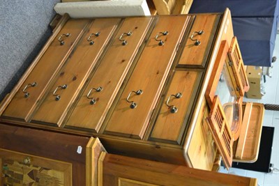 Lot 1040 - A modern pine five height chest, an enclosed wall mirror, a modern pine low three height chest...