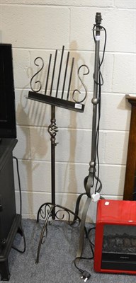 Lot 1048 - A mahogany floor standing lamp, a wrought metal standard lamp and a music stand