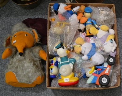 Lot 1053 - Box of assorted Donald Duck and similar Disney memorabilia and a Womble soft toy