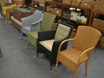 Lot 1090 - A Lloyd Loom two seater settee, three tub shaped armchairs, an ottoman, a linen basket and four...