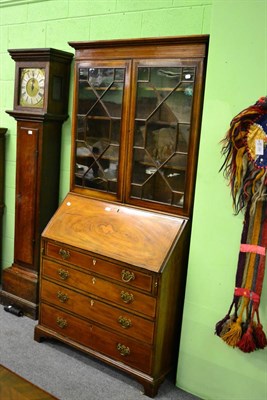 Lot 1110 - An Edwardian mahogany bureau bookcase with crossbanded decoration