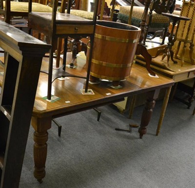 Lot 1128 - A Victorian oak telescopic dining table with winding handle