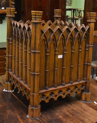 Lot 1135 - A Gothic style walnut log bin