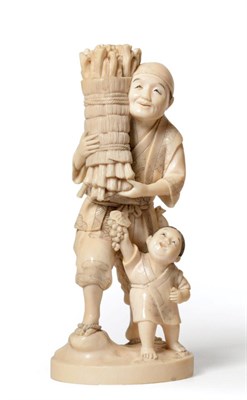 Lot 164 - A Japanese Ivory Okimono, Meiji period, as a man carrying a bundle of faggots, a boy at his...