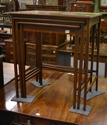 Lot 1147 - Edwardian mahogany nest of three tables