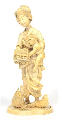 Lot 167 - A Japanese Ivory Okimono, Meiji period, as a mother and child feeding chickens from a basket,...