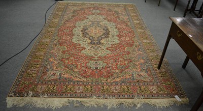 Lot 1151 - Kayseri Carpet, Central Anatolia, the brick red field of scrolling vines around a cream...