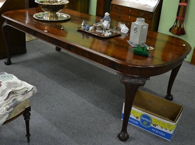 Lot 1160 - A mahogany dining table raised on ball and claw feet