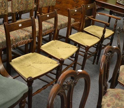 Lot 1171 - A set of four 19th century rush seated bar back dining chairs