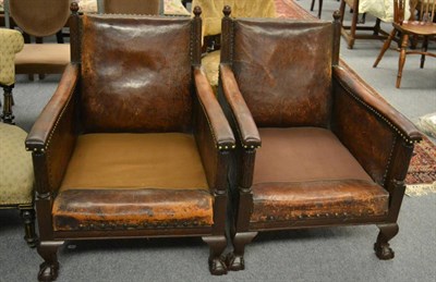 Lot 1174 - A pair of late 19th century mahogany framed library armchairs with leather upholstery (lacking...